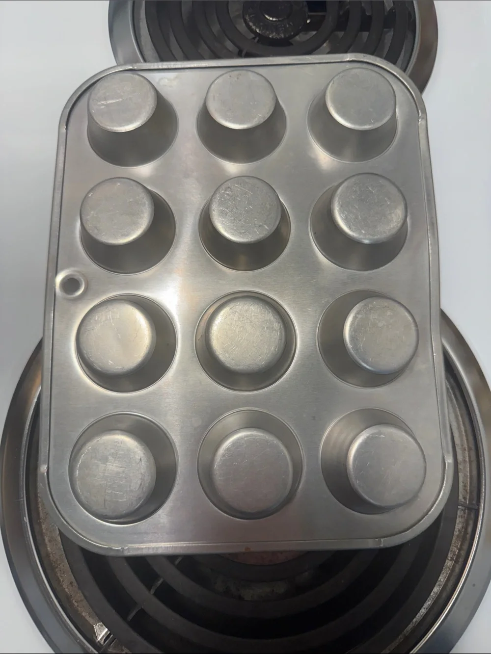 Two muffin pans, the large one is non-stick and NWOT. Small one is in GUC.